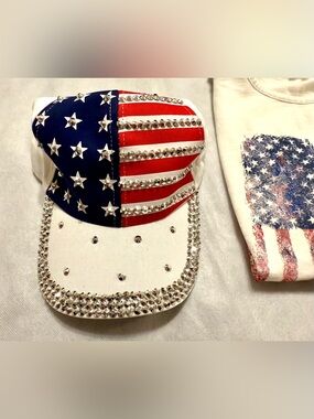 NWTs bedazzled American flag hat with adjustable strap.